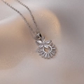 Macro view of flower pendant necklace featuring heart zircon and silver steel chain - Steel / White Flower