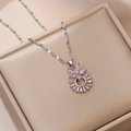 Close-up of pink zircon flower pendant with radiant gemstone on silver chain jewelry - Steel / Pink Flower