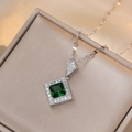 Elegant silver necklace with emerald cut green zircon pendant and halo diamond accents - Emerald Green Zirconia Necklace (X1855)