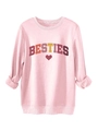 Close-up of pink crewneck sweatshirt with BESTIES text and heart print detail - Pink