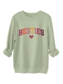 Detail of light green sweatshirt fabric showing soft fleece lining and BESTIES print - Olive Green