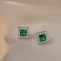 Elegant emerald green halo stud earrings with cubic zirconia on champagne satin background - Emerald Green Earrings (E0334)