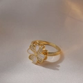 Elegant gold flower ring with white enamel petals and shimmering zircon accents - Gold Heart Four-Leaf Flower (J0061)