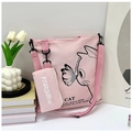 Detailed shot of pink canvas tote bag set with cute cat illustration and mini pouch - Light Pink