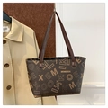 Deep brown tote bag featuring MK letter print with textured leather finish - Brown