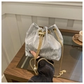 Detail of silver pleated bucket bag with gold chain strap and pearl pendant accent - Silver
