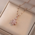 Collana oro rosa con ciondolo fiore a mulino a vento e dettaglio stella in zircone - Stile Girandola Oro Rosa (X2032)