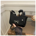 Detail of glossy black patent leather shoulder bag with silver bow and mini card pouch - Black