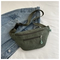 Detailed macro view of dark green corduroy texture and mint green zipper pullers - Dark Green