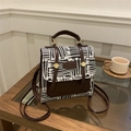 Retro black and white striped canvas backpack with brown leather trim and gold hardware - No Pendant / Brown