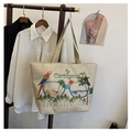 Detail of canvas tote bag featuring vibrant tropical parrot and palm leaf embroidery - Style 5: Parrot & Tropical Leaves (Cartagena)