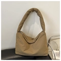 Detail view of khaki padded nylon hobo bag featuring soft texture and silver zipper - Khaki