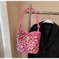 Detailed plush texture of pink leopard print tote bag with dog embroidery and rope handles - Pink