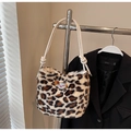 Close-up of leopard print plush tote bag featuring bear embroidery and rope straps - Khaki