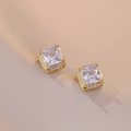 Elegant gold square zircon stud earrings with crystal halo on champagne silk fabric - White Sugar Earrings