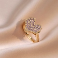 Anello aperto a cuore dorato con zirconi viola incastonati su seta color champagne - Anello a Cuore Viola (J142)