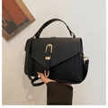 Black litchi grain leather crossbody bag with decorative gold buckle and top handle - Black