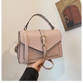 Pink lychee grain leather crossbody bag with gold buckle and adjustable strap - Pink