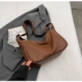 Brown litchi grain PU leather tote bag with a wide fabric strap on a grey blazer - Brown