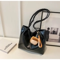 Minimalist black tote bag with woven straps and contrast stitching detail - Black with Pendant