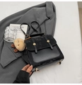 Retro black leather backpack with dual gold snap buttons and plush dog charm - With Charm / Black