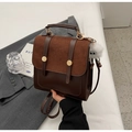 Sac à dos vintage en cuir marron foncé avec charm monstre et textures contrastées - Café et Marron