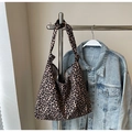 Large leopard print canvas tote bag featuring unique knotted strap design on hanger - Brown