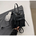 Small black PU leather backpack for women featuring a stylish bow and gold eyelets - Black