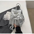 Chic silver faux leather backpack with metallic finish and trendy drawstring bow detail - Silver
