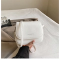 Detail of white PU leather saddle bag showing the Fashion Trend 1996 text and metal buckle - White