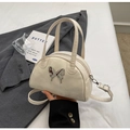 Creamy white bowling bag with silver metal butterfly detail and adjustable crossbody strap - Off White