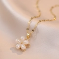 Iridescent flower pendant necklace with gold chain on elegant champagne silk fabric - Gold