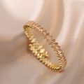 Detailed shot of golden bangle set with champagne marquise-cut sparkling zircons - Gold Full Circle Red Gems (B00432-12)
