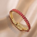 Detail shot of golden telescopic bracelet ring with pink cubic zirconia stones - Gold with Red Marquise Gems (B00432-11)