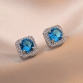 Square halo stud earrings with sky blue gemstone and sparkling zircon surround set in silver - Sea Blue Round Stone Square Halo Style (E530)