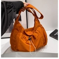 Lightweight bright orange nylon crossbody bag with drawstring design and pleated texture - Orange