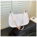 Detail of white glossy patent leather baguette bag with premium golden zipper hardware - White