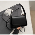 Minimalist black leather crossbody square bag with gold hardware and wide handle - Black