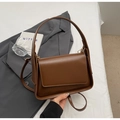 Minimalist dark brown crossbody flap bag in polished PU leather with adjustable strap - Brown