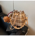 Brown checkered drawstring bucket bag with teddy bear charm and woven handle - Khaki Check With Charm