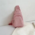 Detail of pink corduroy crossbody bag showing ribbed texture and metal zipper pockets - Pink