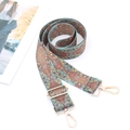 Close-up of ethnic patterned bag strap with golden metal hooks and colorful weave - Polka Dot Rhombus