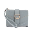 Close-up of light blue quilted short wallet featuring D-ring buckle and wrist strap - Blue