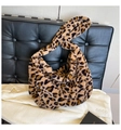 Detail of trendy leopard print plush tote bag with soft faux fur texture and wide strap - Brown