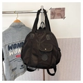 Detail of black waterproof nylon backpack with front flap pocket and sturdy carry handle - Black