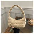 Detail of beige quilted suede shoulder bag with plush handles and zip closure - Khaki