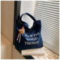 Close-up of dark blue denim tote bag with Catch the Good Things text and bear charm - Dark Blue (With Pendant)