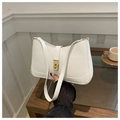 Close-up of white leather underarm bag with gold rectangle turn-lock and neat stitching - White