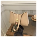 Detail of a beige underarm bag featuring a metallic gold twist-lock and slim shoulder strap - Khaki