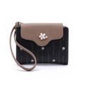 Detail showing high-quality PU leather texture with floral print and 3D flower embellishment - Black